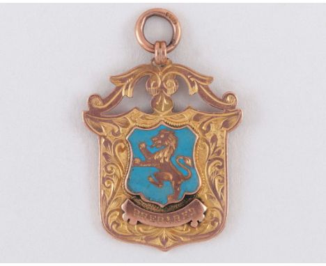 9ct gold and enamel football medal 1911-12, the obverse inscribed PREPARED, the reverse inscribed B & D F.L., CHAMPIONSHIP, A