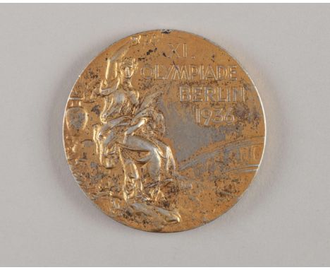 A 1936 Olympic Winners gold medal, designed by Professor Giuseppe Cassioli, manufactured by B H Mayer of Pforzheim, the obver
