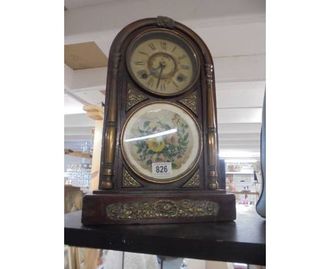 An arched top brass mounted eight day mantel clock. COLLECT ONLY.