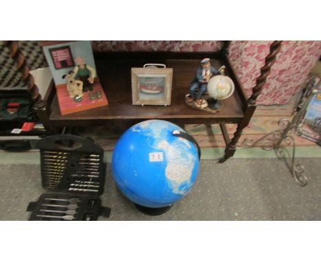 A table globe, a Wallace and Gromit ornament and two other items.