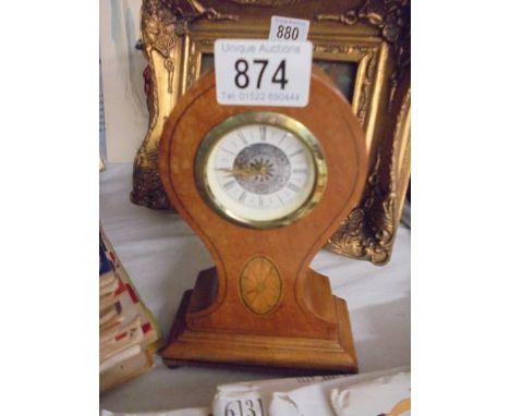 An Edwardian mahogany inlaid mantle clock.