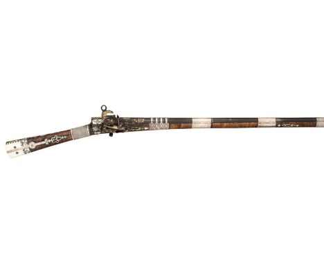 ˜ A 20 BORE CAUCASIAN MIQUELET LOCK RIFLE, MID-19TH CENTURY with tapering russet twist sighted barrel retained by four solid 