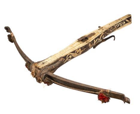 ‡ A LARGE GERMAN DECORATED SPORTING CROSSBOW (GANZE RÜSTUNG), LATE 16TH/EARLY 17TH CENTURY, with heavy steel bow retained by 