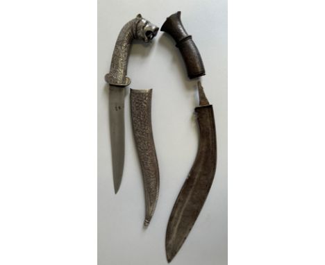 A NEPALESE DAGGER (KUKRI) AND AN INDIAN DAGGER (KHANJAR), 19TH CENTURY of characteristic form, the first with broad blade chi