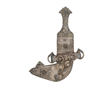 AN ARAB SILVER-MOUNTED DAGGER (JAMBIYA), EARLY 20TH CENTURY with curved double-edged blade formed with a medial ridge, silver