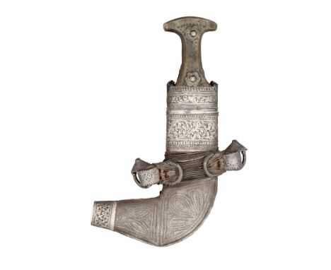 AN ARAB SILVER-MOUNTED DAGGER (JAMBIYA), EARLY 20TH CENTURY with curved double-edged blade formed with a medial ridge, horn h