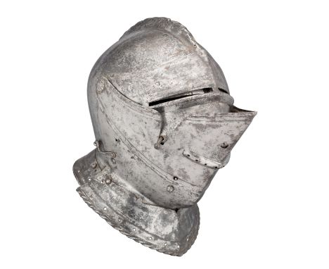 ‡ A COMPOSITE ENGLISH OR FLEMISH CLOSE HELMET, CIRCA 1550 with one-piece skull rising to a low boldly roped medial comb pierc