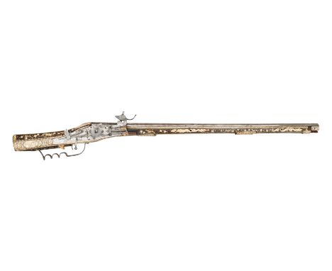 ‡ AN 18 BORE SOUTH GERMAN COMBINED MATCH AND WHEEL-LOCK SPORTING CARBINE DATED 1586 with tapering barrel formed in three stag