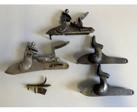 A DETACHED FLINTLOCK MECHANISM, CIRCA 1815 AND THREE FURTHER DETACHED LOCK MECHANISMS the first of 1813 pattern for a light c