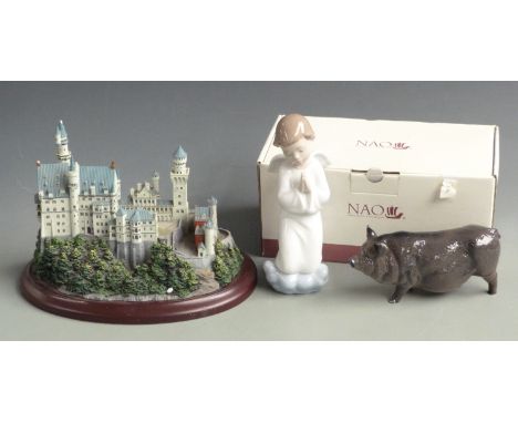 Lenox Great Castles of the World model 'Neuchwanstein', Doulton pig and a Nao figurine, tallest 16cm