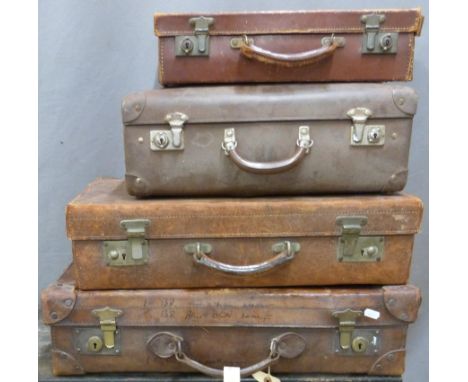 Four various vintage suitcases, three being leather, width of largest 62cm