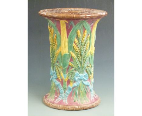 A 19thC Majolica garden seat with sheaves of wheat, corn and basket weave decoration, probably Minton or similar, H 47, D 34c