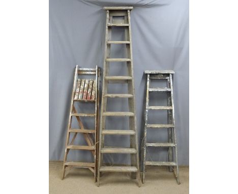 Three vintage wooden step ladders, tallest 230cm