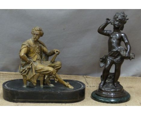 Bronze of a boy holding a basket of fruit, on green marble base, height 39cm together with a gilt metal seated figure on wood