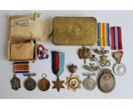A WWI WAR MEDAL AND VICTORY MEDAL (3116 Cpl. H. B. Butler S. Staffs Yeo.) in Christmas 1914 tin with badges and photograph in
