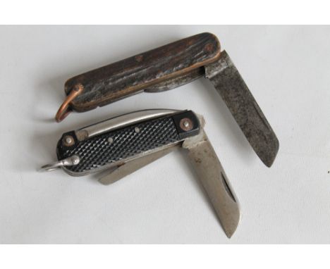 A 1943 BRITISH MILITARY THREE PIECE JACK KNIFE with black plastic grips by W & S Butcher, Sheffield (Wade & Butcher), togethe