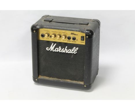 A SMALL MARSHALL MG10CD AMPLIFIER 