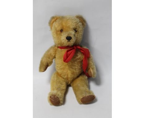 A GOLD PLUSH TEDDY BEAR (POSSIBLY CHAD VALLEY), with jointed body and musical movement