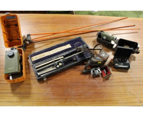 A KERN SURVEYOR'S LEVEL IN CASE together with a small Kern surveyor's level with Bakelite case, and a selection of surveyor's