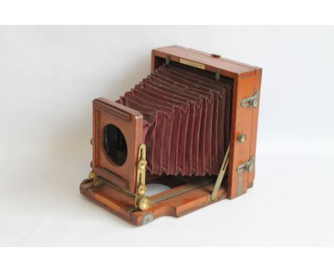 A LATE 19TH CENTURY MAHOGANY BELLOWS PLATE CAMERA, marked 'The 1890 Instantograph Patent' and 'J. Lancaster & Son Birmingham'