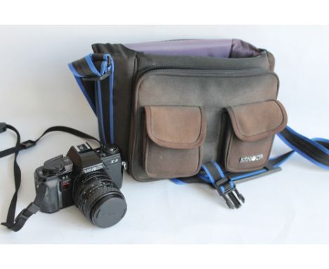 A MINOLTA XG9 CAMERA with Sigma master zoom and Sigma 70 - 210 mm VC zoom + flashes, tripod etc in Minolta carry bag