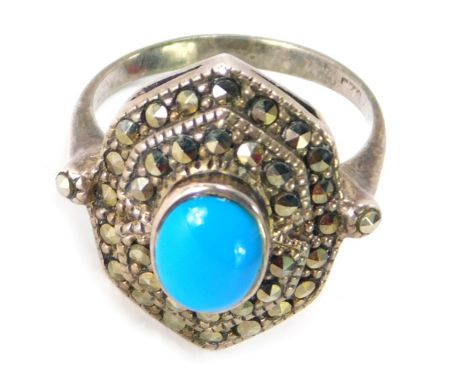 A silver, marcasite and turquoise set dress ring, in the Art Deco style with central turquoise on two outer fanned marcasite 