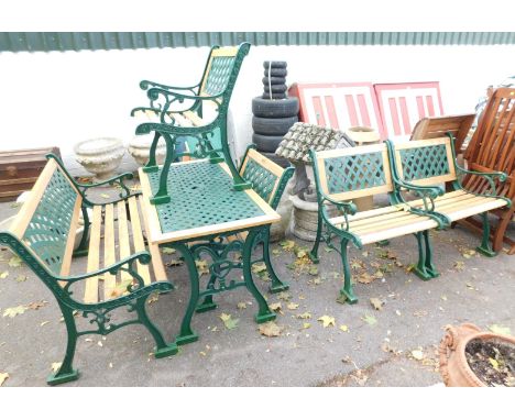 A pine and wrought iron garden furniture set, comprising a three seater bench&nbsp; and four single chairs. (5)&nbsp;