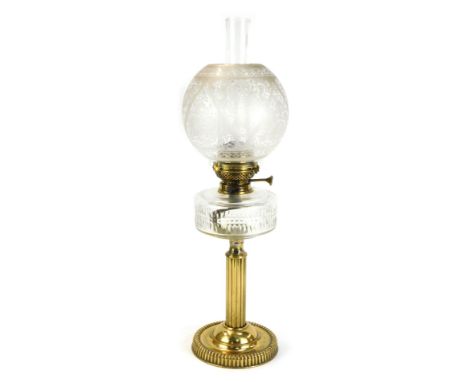 A 19thC brass oil lamp, with glass reservoir, Corinthian column support, with floral glass shade, 55cm high. 