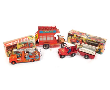 Friction powered toys, comprising fire engine, instant truck and trailer and an Oakleys knife polish, advertising bus, two bo