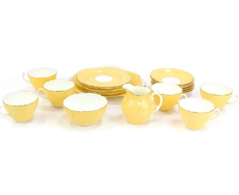 A Coalport Fleur pattern part tea service, comprising cake plate, six cups and saucers, milk jug, sugar bowl and five side pl