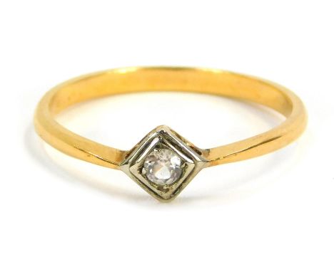 A diamond dress ring, the central diamond shaped rub over setting, with round brilliant cut diamond, in platinum, on a yellow