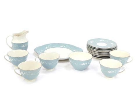 A Royal Doulton Reflections part tea service, on a blue ground with white vine flowers, comprising five cups, four saucers, s