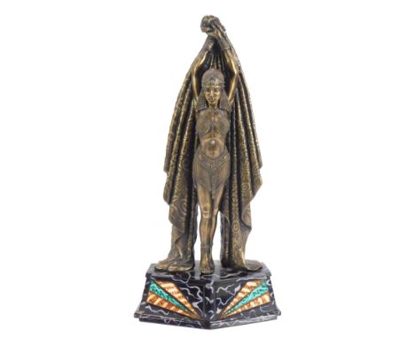 An Art Deco style figure, of a lady carrying drape, on marble effect coloured base, 52cm high.