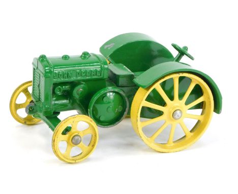 A John Deere model D diecast tractor, boxed.