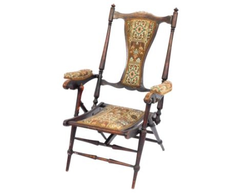 An Edwardian mahogany folding steamer chair, with tapestry floral inlays.