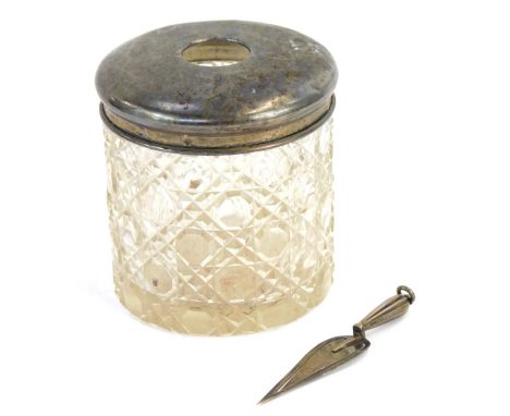 A silver topped dressing table jar and a miniature silver trowel, weighable silver ¾oz. 