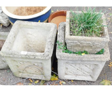 A pair of reconstituted stone planters, each square set, with patched star design, 36cm high, the top 34cm x 34cm, and a smal