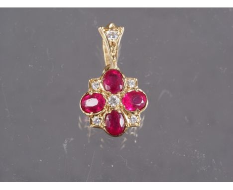 A 9ct gold, diamond and ruby pendant, 1.1g