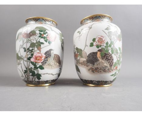 A pair of early 20th century Chinese cloisonne enamel vases, silver wire, decorated with quail amongst peonies and trailing f