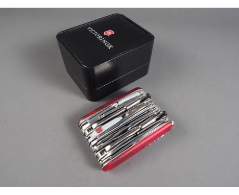 A Victorinox "Swiss Champ XAVT" 80 function pocket knife with translucent scales, light and clock, in original case