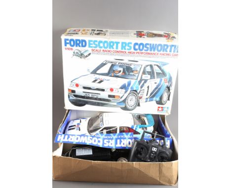 A Tamiya micro controlled Ford Escort RS Cosworth 1/10 scale model with controllerWe would post this lot to a UK address for 