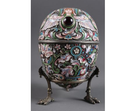 An early 20th century Russian cloisonne enamel work on silver egg with gilt interior, the top set ruby coloured cabochon, mou
