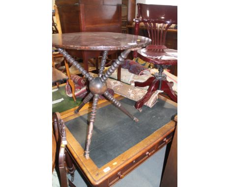 A polished as mahogany "Gypsy" table, on bobbin tripod support and cloven hoof feet, 23 1/2" dia x 25" high