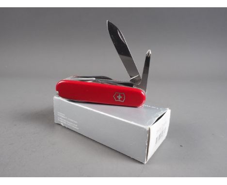 A Victorinox Swiss Army "Champ 1.6795" pocket knife, in original box