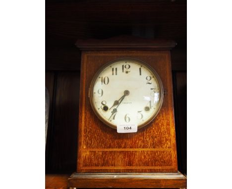 An American mahogany and inlaid cased mantel clock with Arabic numerals, 11 3/4" high, and a Vienna wall clock with floral de