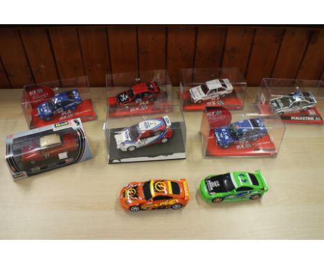 Four Scalextric Ford Escort MKII, a similar Scalextric model, a Ford Focus, a Revell Lotus Cortina Allan Mann Racing", boxed,