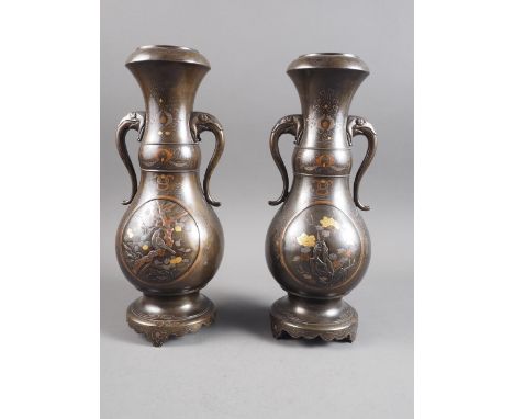 A pair of 19th century Japanese bronze and precious metal inlaid double gourd vases with elephant head handles, 13" high