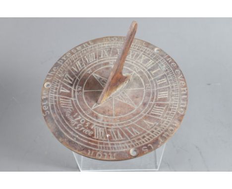 A brass sundial, 6" dia