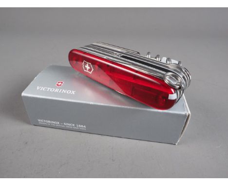 A Victorinox Swiss Army "Cyber Tool" pocket knife with translucent scales, in original box