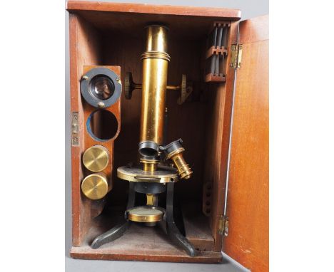A Swift &amp; Son of Tottenham brass mounted microscope, in wooden travelling case